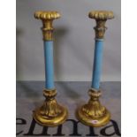 A pair of parcel gilt blue painted Rococo Revival candlesticks, 67cm high x 12cm diameter at base,