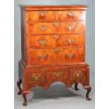 A George I and later walnut chest-on-stand with two short over three long graduated drawers,