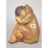 A Lladro matte glaze figure of a sleeping Eskimo, blue printed mark to base, 25cm high.