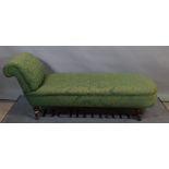 A Victorian scroll end chaise longue on turned walnut supports 180cm wide x 80cm high.