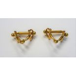 A French pair of gold cufflinks, designed as mouth bits for horses bridles,