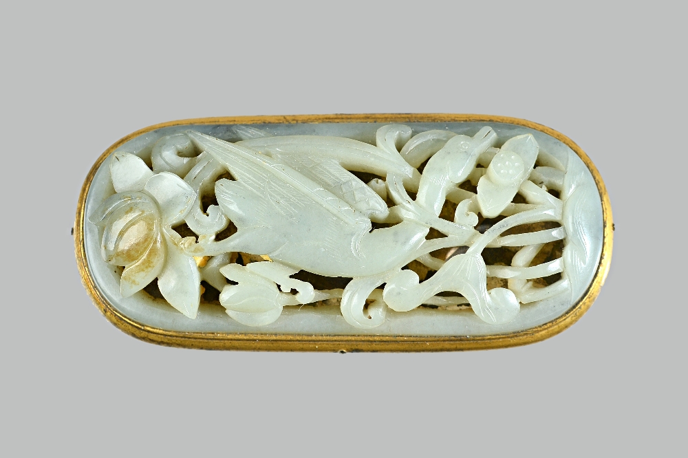 A Chinese celadon jade plaque, probably 17th/18th century, set with a gilt-metal mount,