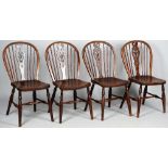 A set of four 19th century ash and elm splat back chairs on turned supports and stretchers,