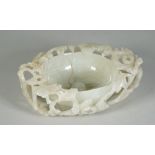 A Chinese pale celadon jade `floral' brush washer, 17th century or possibly later,