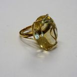 A 9ct gold and citrine single stone ring, claw set with an oval cut citrine, London 1952,