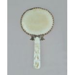 A Chinese jade and gilt-metal mounted hand mirror, 19th century,