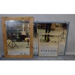 An early 20th century rectangular pine mirror with bevelled glass 78cm wide x 107cm high,