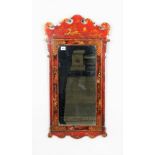 A George II style red lacquer fret cut wall mirror, 45cm wide x 87cm high.