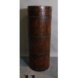 An early 20th century pitch pine and iron bound stick stand of cylindrical form,