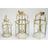 A pair of modern brass hall lanterns of octagonal form, with internal three light fitment,