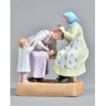 A Russian biscuit porcelain figure group depicting hair combing, Gardner factory, late 19th century,