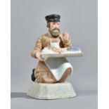 A Russian biscuit porcelain figure of a fruit vendor, Gardner factory, late 19th century,