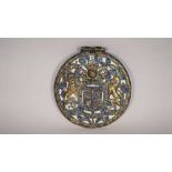 A Charles II gilt bronze and enamel circular Royal Coat of Arms panel,