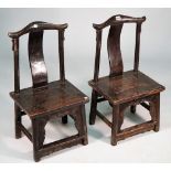 A pair of 19th century Chinese child's yoke back chairs, on turned supports, 38cm wide x 73cm high.