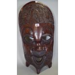 A large mid-20th century African carved hardwood mask.