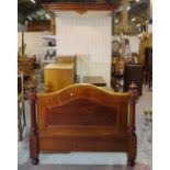 A Victorian single mahogany half-tester bed, with white striped upholstered canopy, on bun feet,