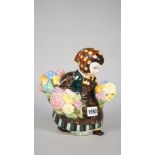 A Lenci figure, 'flower girl', early 20th century, maker's marks and paper label to base, 21cm high.