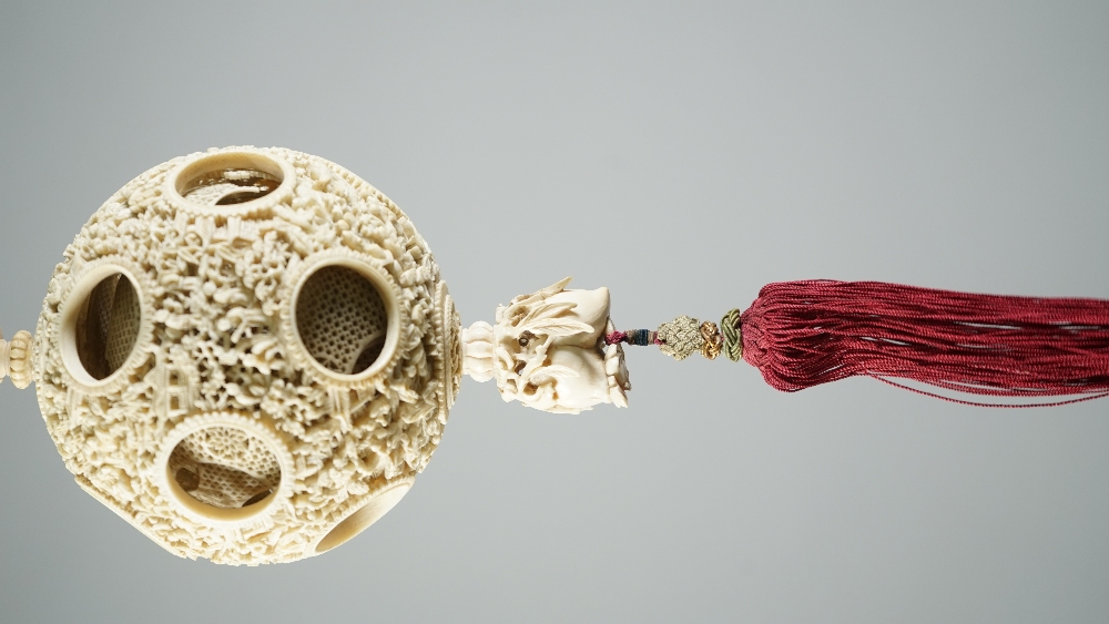 A Canton ivory puzzle ball, late 19th century, the outer ball pierced and carved with figures, - Image 4 of 6