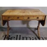 A Regency mahogany sofa table with two drawers on duel ended supports.