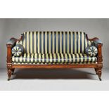 A Regency mahogany framed sofa, the square back with downswept sides,