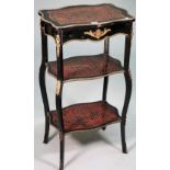 A late 19th century ebonised boulle work gilt metal mounted three tier etagere of serpentine