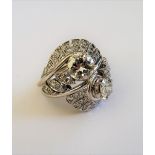 A diamond set dress ring, circa 1930s, of cross over design,