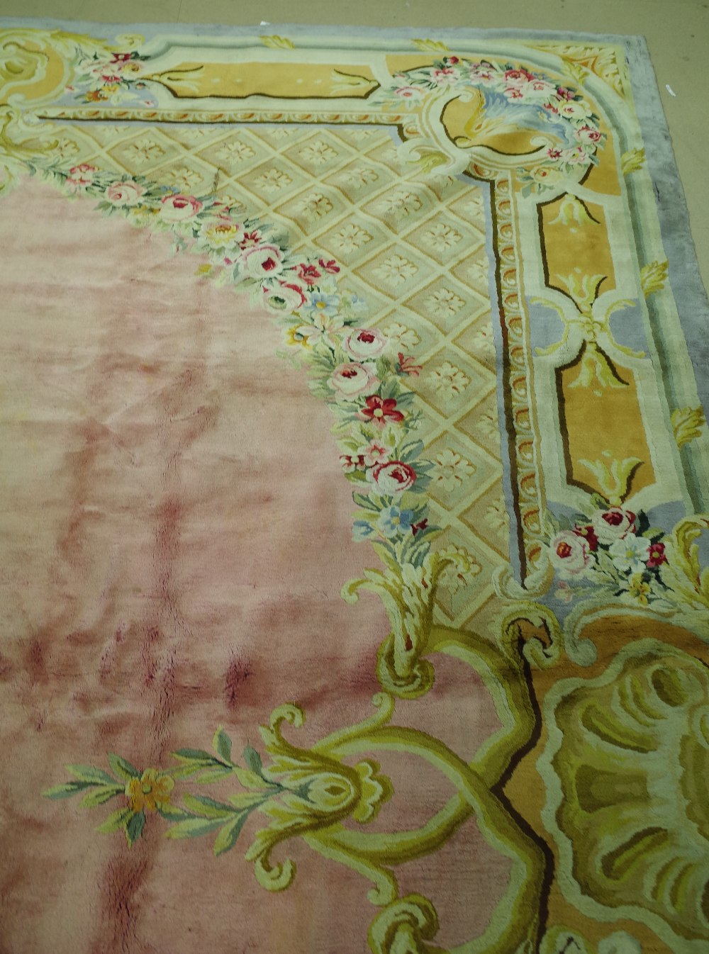 A Savonnerie carpet, French, the plain pale pink field with trellis spandrels and floral garlands, - Image 2 of 16