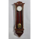 A Viennese parcel-gilt mahogany three-train quarter chiming regulator with music box By Joseph