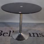 A modern circular smoked glass dining table with chrome metal base, 80cm diameter x 77cm high.