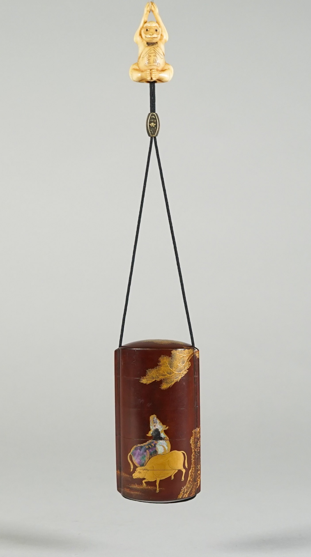 A Japanese brown- ground four-case inro, 19th century,