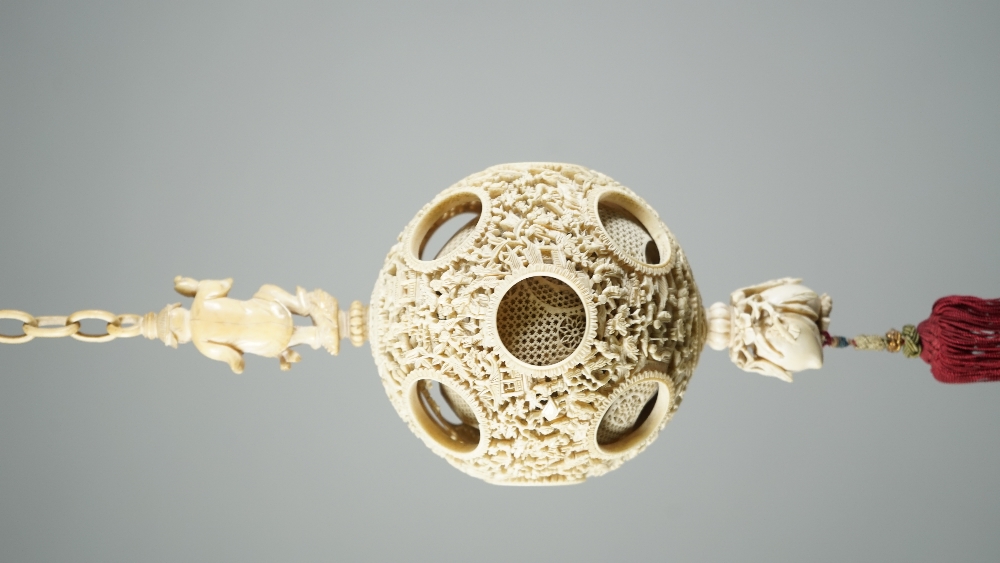 A Canton ivory puzzle ball, late 19th century, the outer ball pierced and carved with figures, - Image 6 of 6