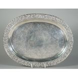 A Chinese export silver salver, mark of Hoaching, late 19th century, of oval form,