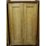 An early 20th century pine double wardrobe, 105cm wide x 170cm high.