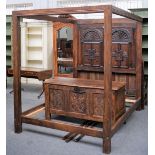 A 17th century style oak four poster bed,
