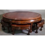 A 20th century Chinese hardwood oval low centre table 150cm wide x 51cm high with four matching