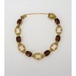 A gold and citrine set bracelet,