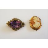 A 9ct gold, amethyst and seed pearl set brooch, claw set with the oval cut amethyst to the centre,