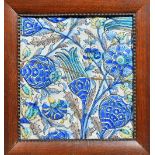 Three large Qajar pottery tiles in the Iznik style, 19th century,each moulded with carnations,