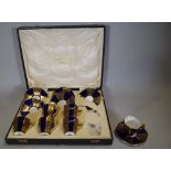 A Royal Doulton twelve piece coffee set, cased, with blue and gilt decoration.