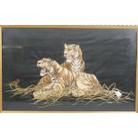 A Japanese embroidered picture of two tigers, early 20th century, 30cm. by 48cm., framed and glazed.