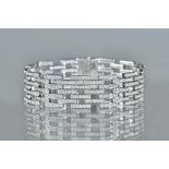 An 18ct white gold and diamond set bracelet, in a multiple row bar link design,