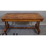 A late Victorian walnut and satinwood inlaid low side table on dual ended supports united by turned