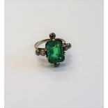 An emerald and diamond ring,