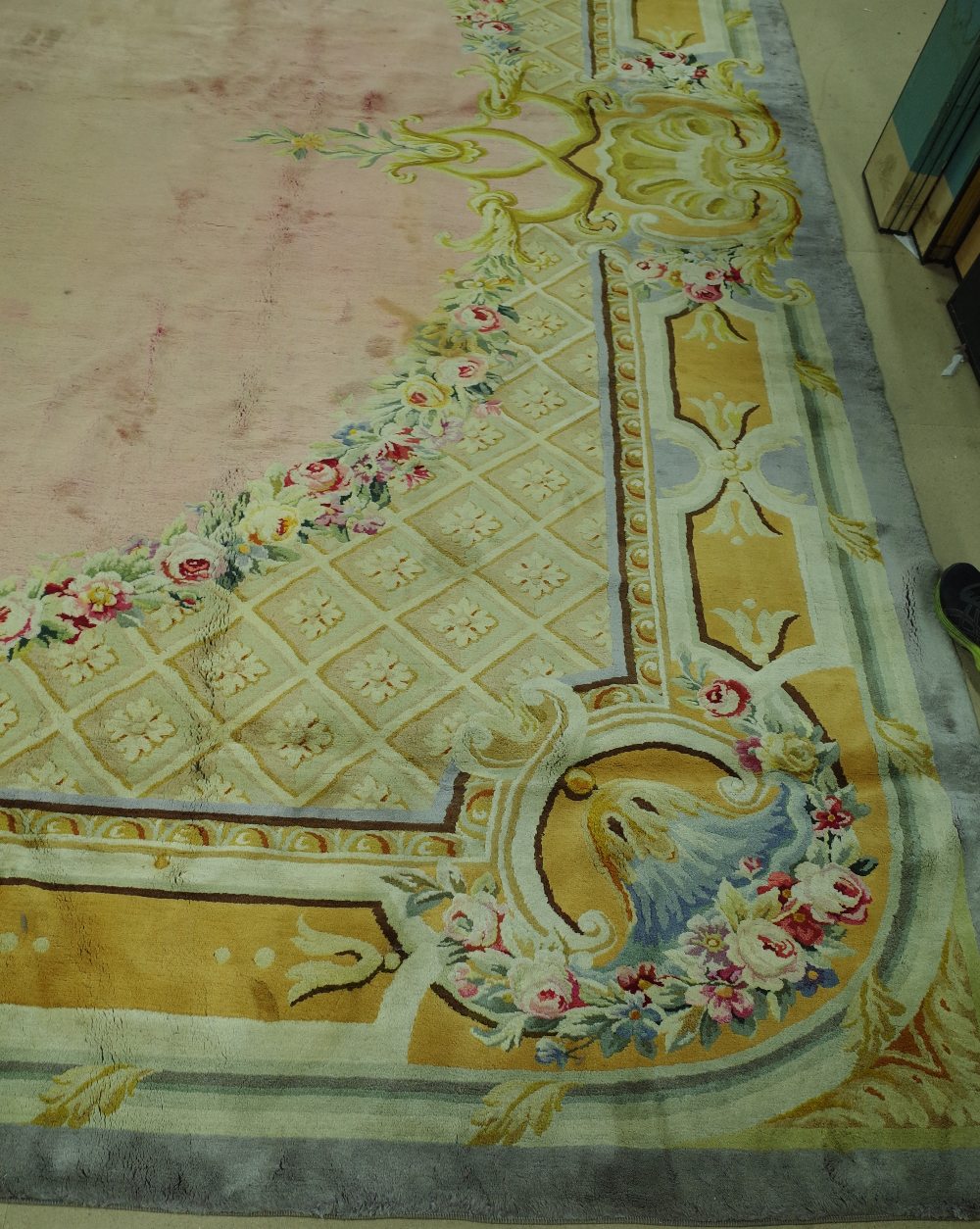 A Savonnerie carpet, French, the plain pale pink field with trellis spandrels and floral garlands, - Image 7 of 16