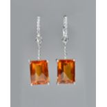 A white precious metal citrine and diamond set pendent earrings and pendant suite,
