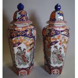 A pair of 20th century Imari style vases and cover of tapering octagonal form, 46cm high, (2).