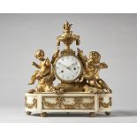 A French ormolu and white marble mantel clock In the Louis XVI style,