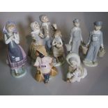 Ceramics, Lladro, a group of six figures including bisque glazed figures, carol singers, etc.