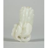A Chinese pale celadon jade snuff bottle, Qing dynasty, carved as a finger citron, 7cm long.