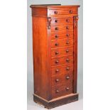 A Victorian Wellington chest with ten graduated drawers enclosed by double locking bar on plinth